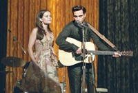 Reese Witherspoon plays June Carter Cash, singing onstage with Johnny
