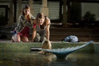 Claire and Hailey are startled to find a mermaid (Sara Paxton) in the pool