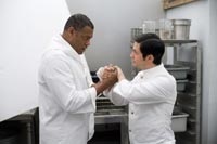 Laurence Fishburne and Freddy Rodriquez as kitchen employees