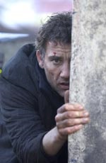 Clive Owen as Theo, a disillusioned bureaucrat