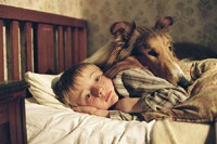 A boy (Jonathan Mason) and his dog