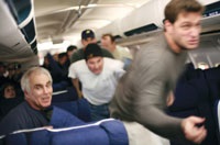 Crew and passengers charge the cockpit to reclaim the plane from the hijackers