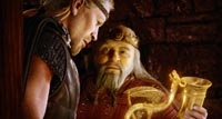 King Hrothgar (Anthony Hopkins) rewards the warrior for his heroism