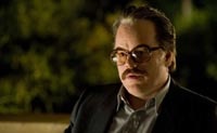 Philip Seymour Hoffman as Gust Avrakotos