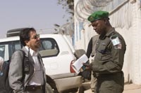 Pablo Recalde of the World Food Program meets with a Sudanese soldier