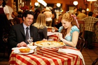 Robert (Patrick Dempsey) and Giselle have a laugh over a pizza