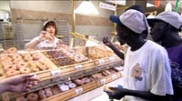 Several of the Lost Boys discover donuts on their first grocery store trip