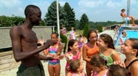 Daniel Abul Pach with some admirers at a Pittsburgh pool