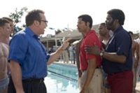Tom Arnold plays an opposing coach with racist issues