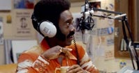 Don Cheadle as radio talk show host Petey Greene