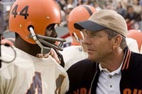 Rob Brown as Ernie Davis, Dennis Quaid as Coach Schwartzwalder