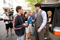 Singer on set with Brandon Routh, who plays Clark Kent/Superman