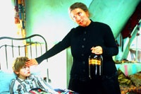 Nanny McPhee tends to one of the children, who was pretending to be sick