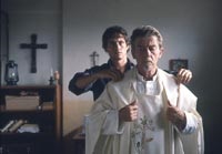 Hugh Dancy as a young teacher, John Hurt as a Catholic priest