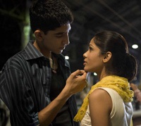 Dev Patel as Jamal, Freida Pinto as Latika