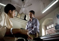 A police inspector (Irrfan Khan) interrogates Jamal