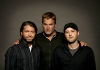 Michael W. Smith flanked by Mark Cowart (L) and son Ryan Smith
