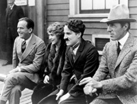 Griffith with Douglas Fairbanks, Mary Pickford, and Charles Chaplin