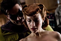 Jeffrey Dean Morgan as The Comedian, Carla Gugino as the original Silk Spectre