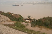 The Yu home is flooded by the rising Yangtze