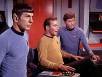 Spock, Kirk, and McCoy on the bridge