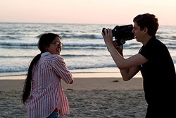 Yi and Cera, filming at the beach