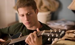 Zach Gilford as Adam Davies