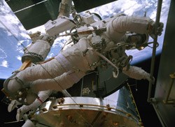 Astronaut Andrew Feustal working on the Hubble