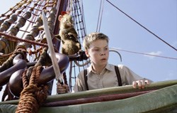 Will Poulter as Eustace, with the brave mouse Reepicheep