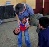 Groves playing with a boy at a Compassion facility in Guatemala