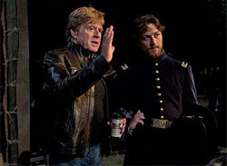 Director Redford on the set with McAvoy