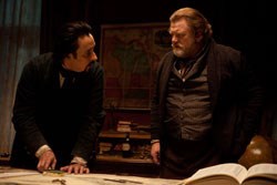 Poe makes a point to Captain Hamilton (Brendan Gleeson)