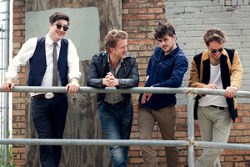 Marcus Mumford (left) and his bandmates