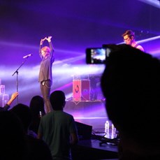 Pastor Banning Liebscher snaps a photograph of Kim and Jesus Culture at their Chicago One-Night Event, April 2013