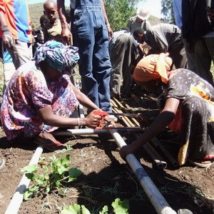 Women constructing a drill