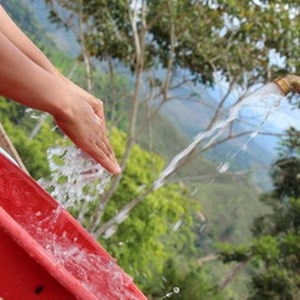 Approximately 1 million people lack access to clean water in Honduras. Here unfiltered water is used to wash hands and dishes after a meal in Los Cedros, Honduras.