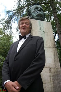 Stephen Fry with a bust of Wagner as seen in WAGNER AND ME.