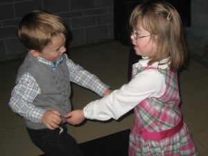 Penny and William dancing in the church vestibule