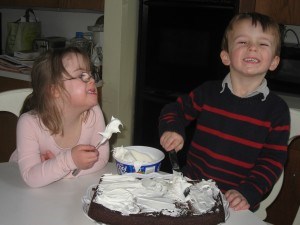 Penny and William making Marilee's birthday cake