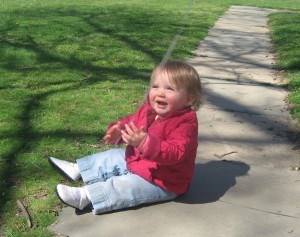 Delighted by a pink balloon