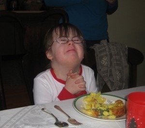 Penny praying before Christmas dinner a few years ago