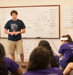 A student explains his faith at a speedfaithing event.