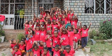 The children in front of Bright Future Academy