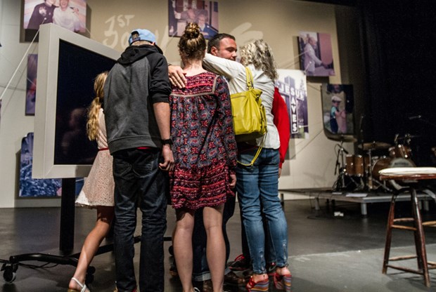 Driscoll's family embraces him after Sunday's announcement.