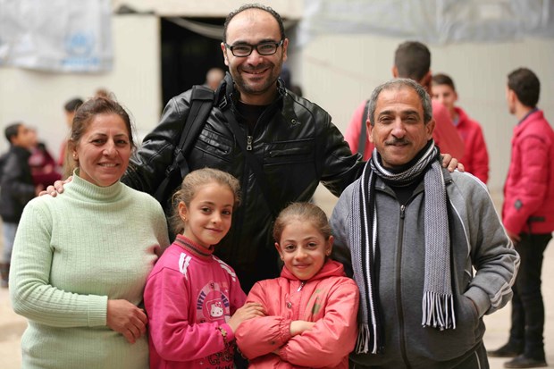 Myriam's family with SAT-7 journalist.