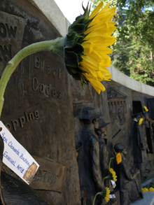 Flowers placed in memory of the victims at the African American history monument at the Capitol.