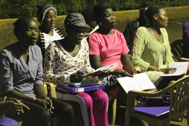 Churchgoers practice songs as the sun sets at the Catholic Martyrs' Shrine.