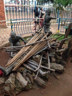 Statues depict workers building a pyre where young men were burned to death at Catholic Martyrs' Shrine. The young men died for their faith in 1886 after resisting the edicts and homosexual advances of King Mwanga. Statues depict workers building a pyre where young men were burned to death at Catholic Martyrs' Shrine. The young men died for their faith in 1886 after resisting the edicts and homosexual advances of King Mwanga.