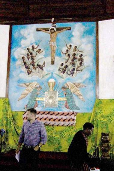 Artwork inside the basilica at the Catholic Martyrs' Shrine shows the young martyrs clothed in white and lifting their arms to Jesus. Artwork inside the basilica at the Catholic Martyrs' Shrine shows the young martyrs clothed in white and lifting their arms to Jesus.
