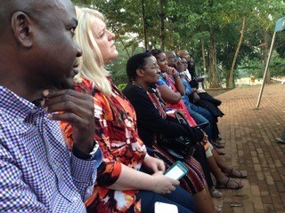 Journalists visiting from Nigeria, Uganda, Kenya, Tanzania, and the United States listen to a tour guide describing the history at the Catholic Martyrs' Shrine. Journalists visiting from Nigeria, Uganda, Kenya, Tanzania, and the United States listen to a tour guide describing the history at the Catholic Martyrs' Shrine.